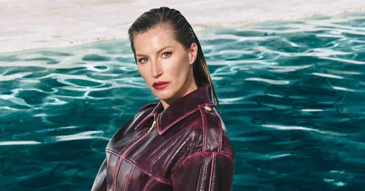 Gisele Bündchen wearing a burgundy leather jacket by a pool for Elisabetta Franchi Fall-Winter 2025 campaign.