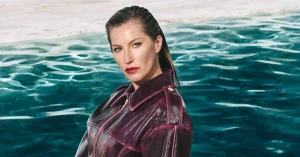 Gisele Bündchen wearing a burgundy leather jacket by a pool for Elisabetta Franchi Fall-Winter 2025 campaign.