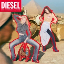 Two fashion models with red sticker outlines posed on a rooftop with a pyramid in the background for a Diesel campaign.