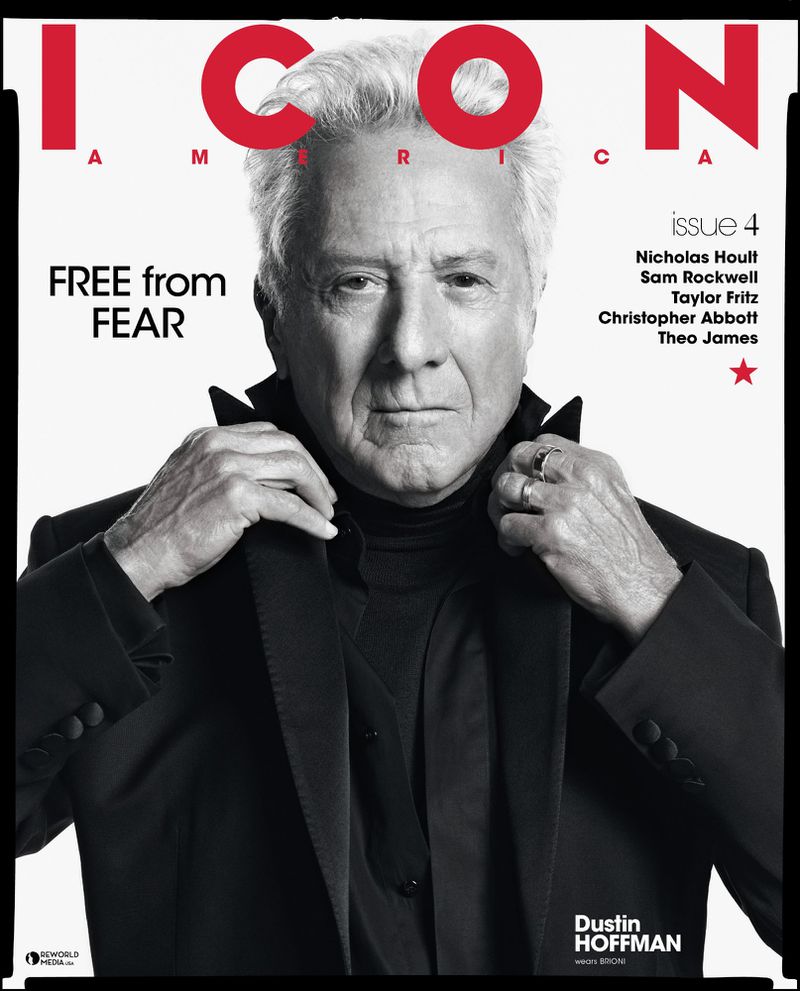 Actor Dustin Hoffman wearing a black tailored jacket and turtleneck for the cover of ICON America on a white studio background.