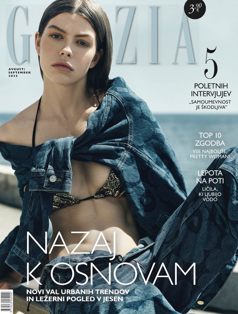 Magazine cover featuring a woman wearing a denim jacket and bikini top, set against a blurred outdoor backdrop.