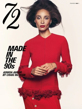 Model Adwoa Aboah wearing a red textured-trim suit with retro bouffant hair against an off-white background for 72 Magazine.
