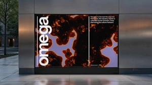Outdoor billboard on a metallic building facade displaying Omega Yeast branding with abstract organic textures and bold typography.
