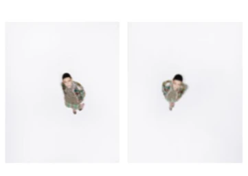 High overhead view diptych of model Luiza Perote standing centered in a vast white studio space.