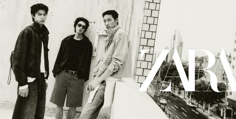 Three male models in casual streetwear posing along an urban rooftop ledge for a Zara campaign.