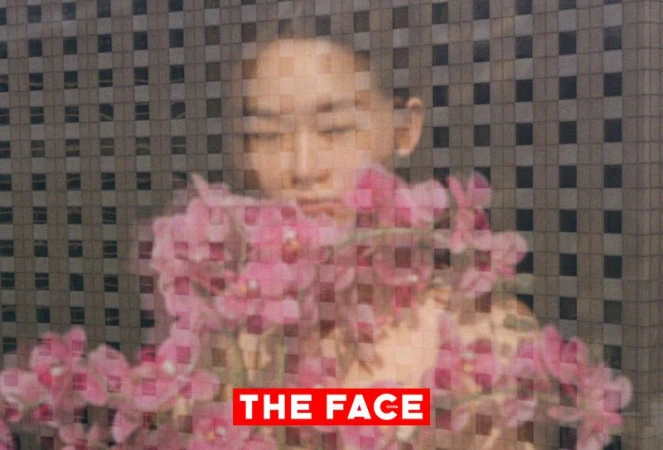 Portrait of an East Asian model overlaid with a woven checkerboard grid and surrounded by pink orchids with The Face China logo.