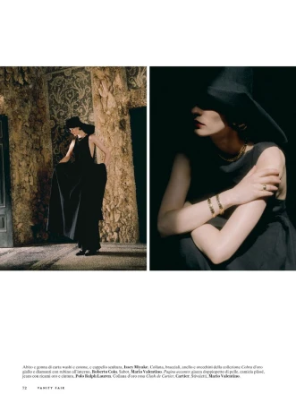 Model Hannah Weber wearing a black gown, wide-brim hat, and gold jewelry in an editorial spread for Vanity Fair Italia.