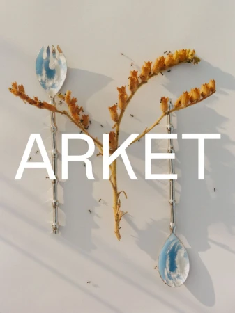 Silver fork and spoon arranged with dried yellow botanical stems and ants on a neutral background under the Arket logo.