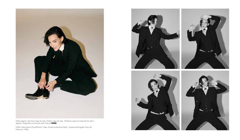 Magazine spread of actress Vicky Luengo in a black tailored suit and boots posing against a white studio background.