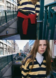 Model Valerie Margareta in a yellow and navy striped polo with a red sweater tied around the waist on an urban street.