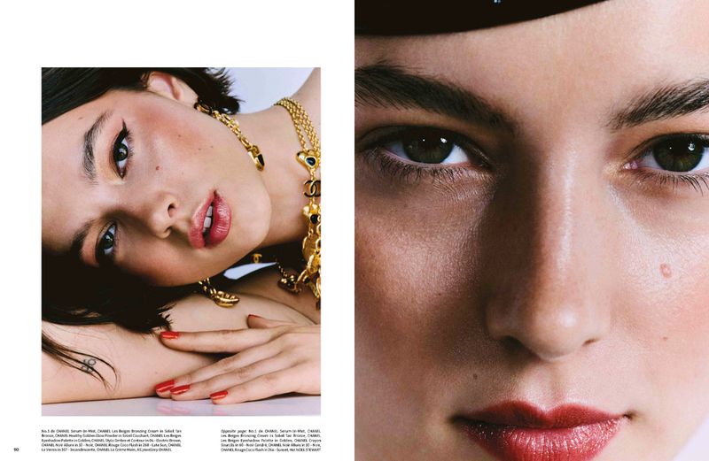 Beauty shot featuring a woman with red lips, red nails, and gold jewellery, captured in a close-up with soft lighting.