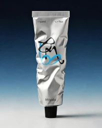 Squeezed metallic silver tube packaging with a black ribbed cap and abstract blue graphics standing against a gradient background.