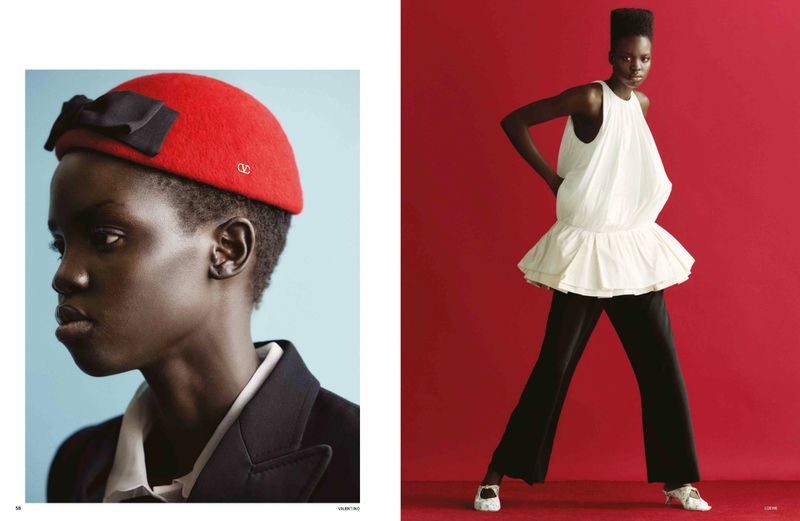 Editorial fashion shot of a Black woman in a red hat and a Black woman in a white top and black pants against red and blue backdrops.