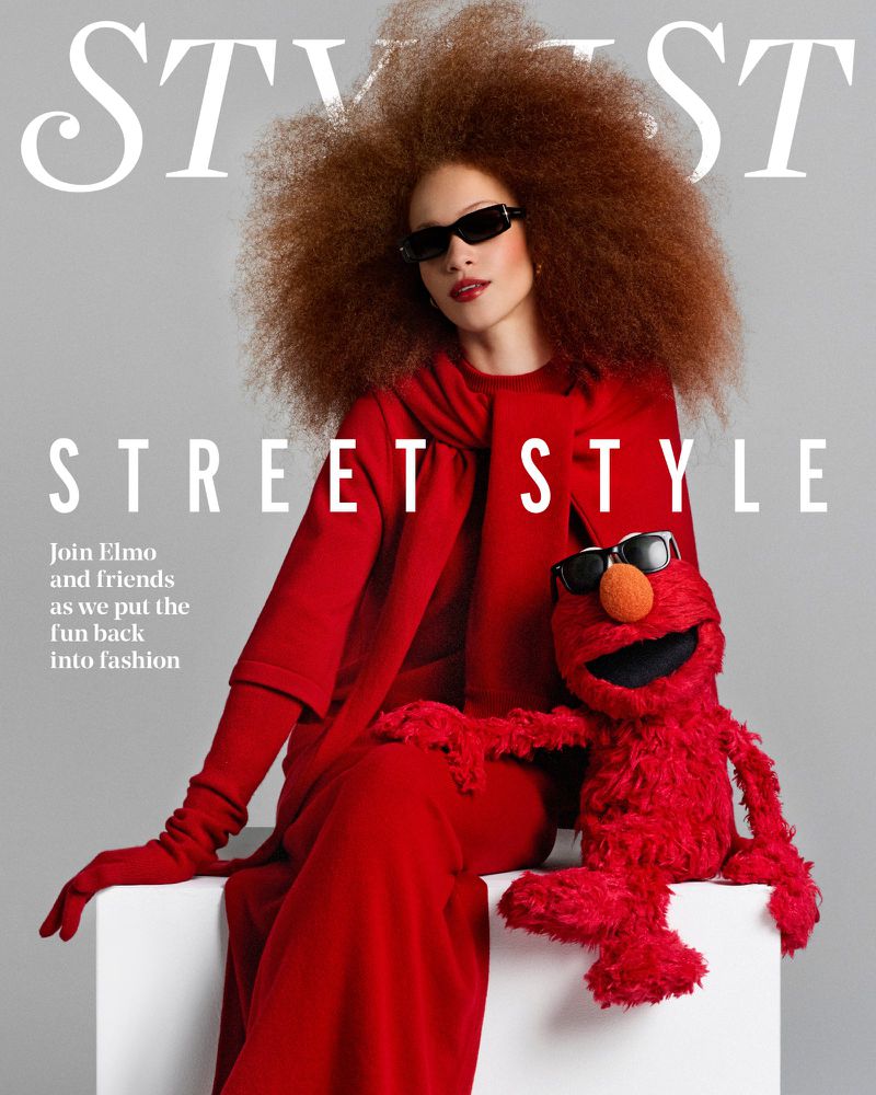 Model Tianna St. Louis and Elmo pose in matching sunglasses and vibrant red outfits on the Stylist Magazine UK cover.