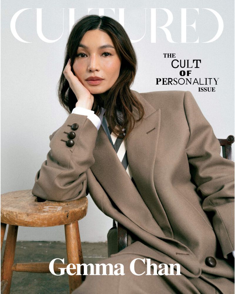 Gemma Chan wearing an oversized taupe tailored coat with a striped tie for Cultured Magazine cover