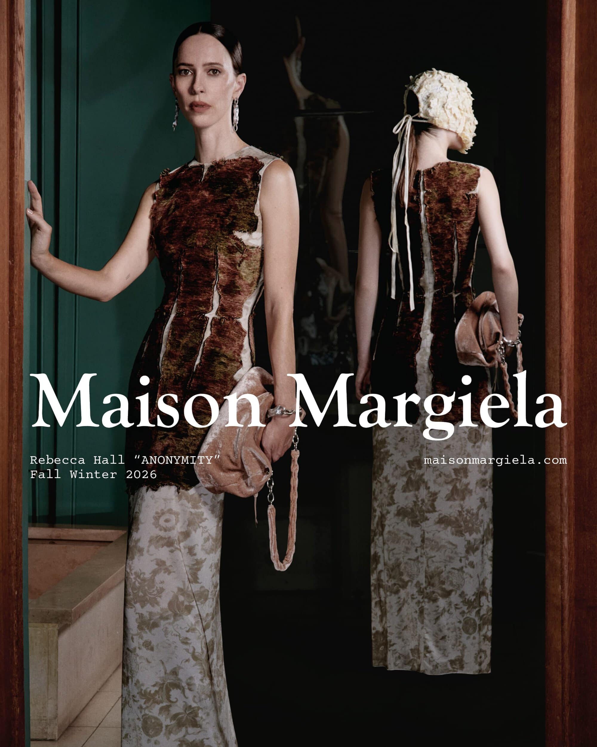 Rebecca Hall posing in a sleeveless textured dress and holding a blush handbag for the Maison Margiela campaign.