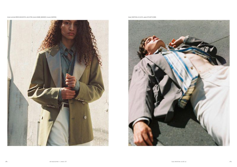 Editorial magazine spread featuring a woman standing in an olive blazer and a man lying back on asphalt in natural sunlight.
