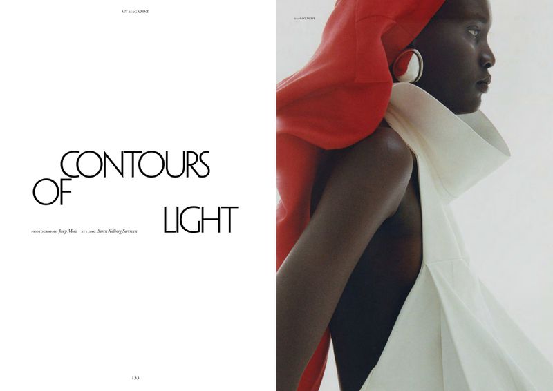 Editorial magazine spread of a Black woman wearing a sculptural white collar top and red draped headpiece beside minimalist typography.