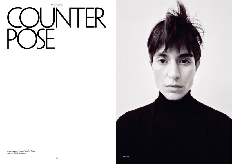 Model Mariane Godoy with short dark hair in a black turtleneck against a white background in a magazine spread.
