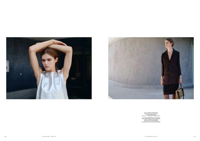 Double-page editorial spread featuring model Anna Robinson in a silver sleeveless top and a dark tailored blazer holding a handbag.
