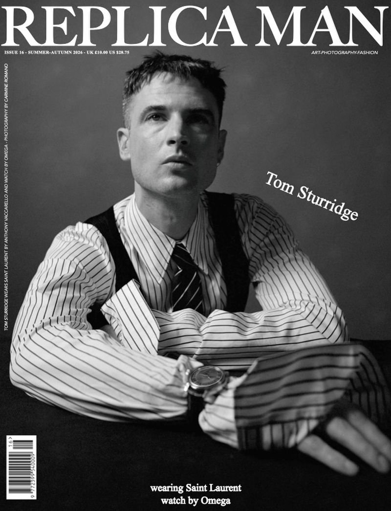Tom Sturridge wearing a striped collared shirt and black vest on the black and white cover of Replica Man Magazine.