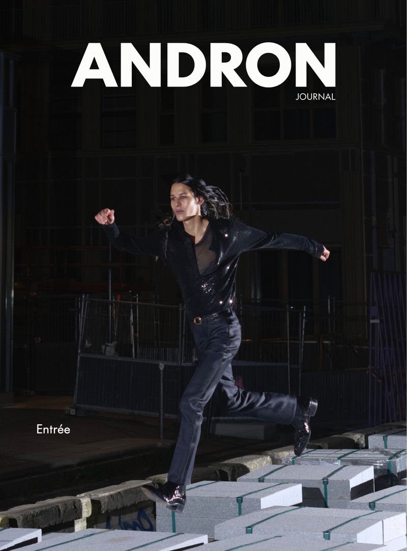 Magazine cover with a stylish adult female in motion against an urban backdrop, showcasing fashion and editorial elements.
