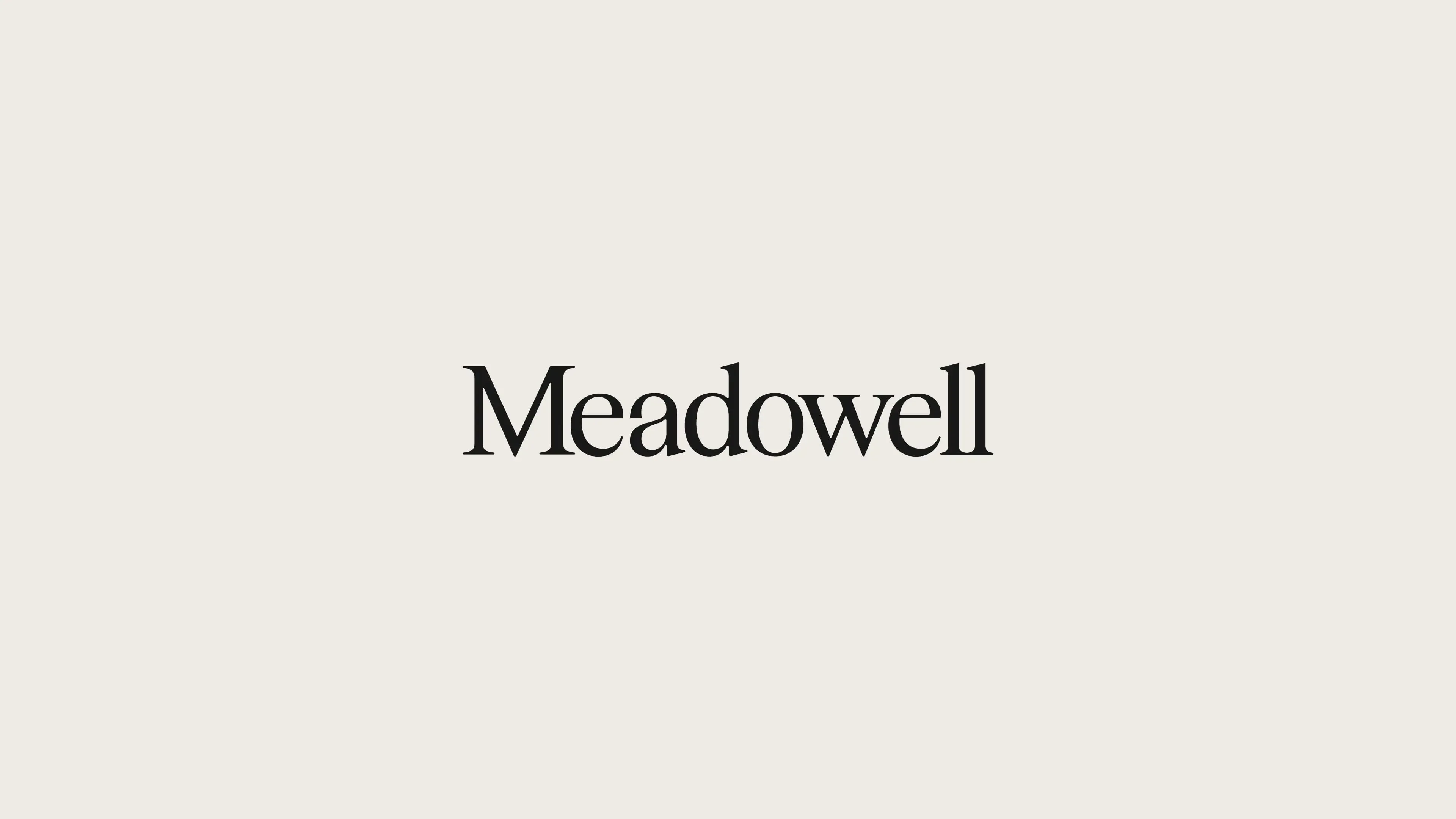 Meadowell typography logo centered on a neutral off-white background