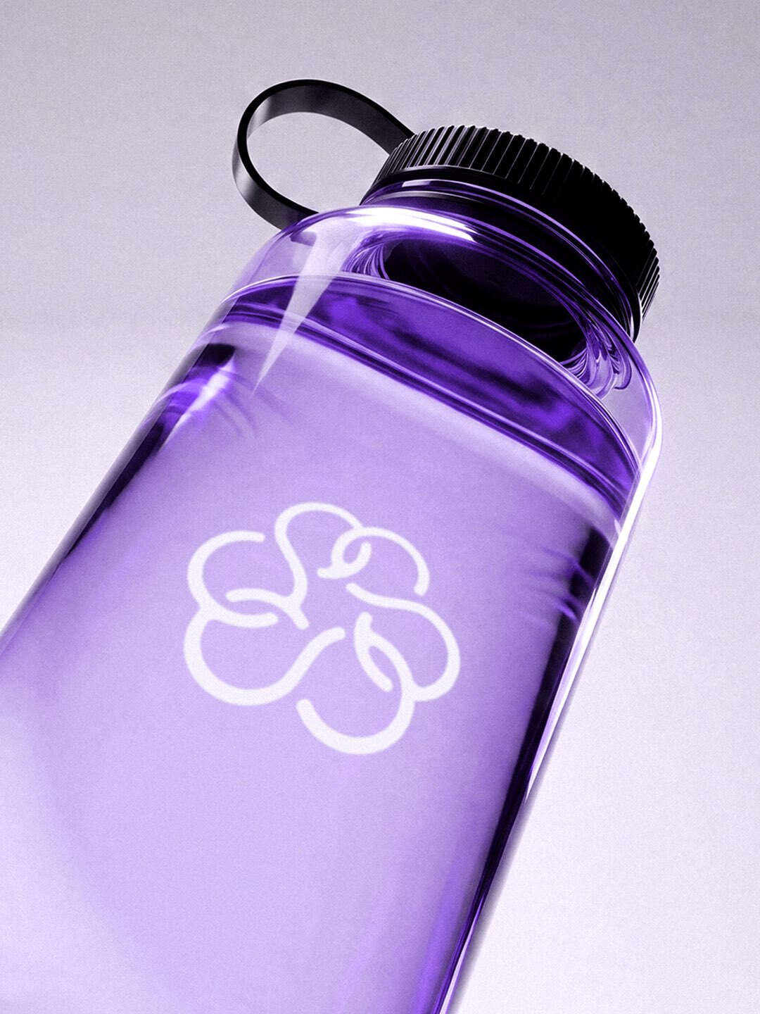 Translucent purple reusable water bottle with a black screw cap and white floral logo print against a pale background.