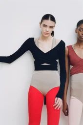 Two female models wearing activewear tops and leggings against a white background for Beyond Noise