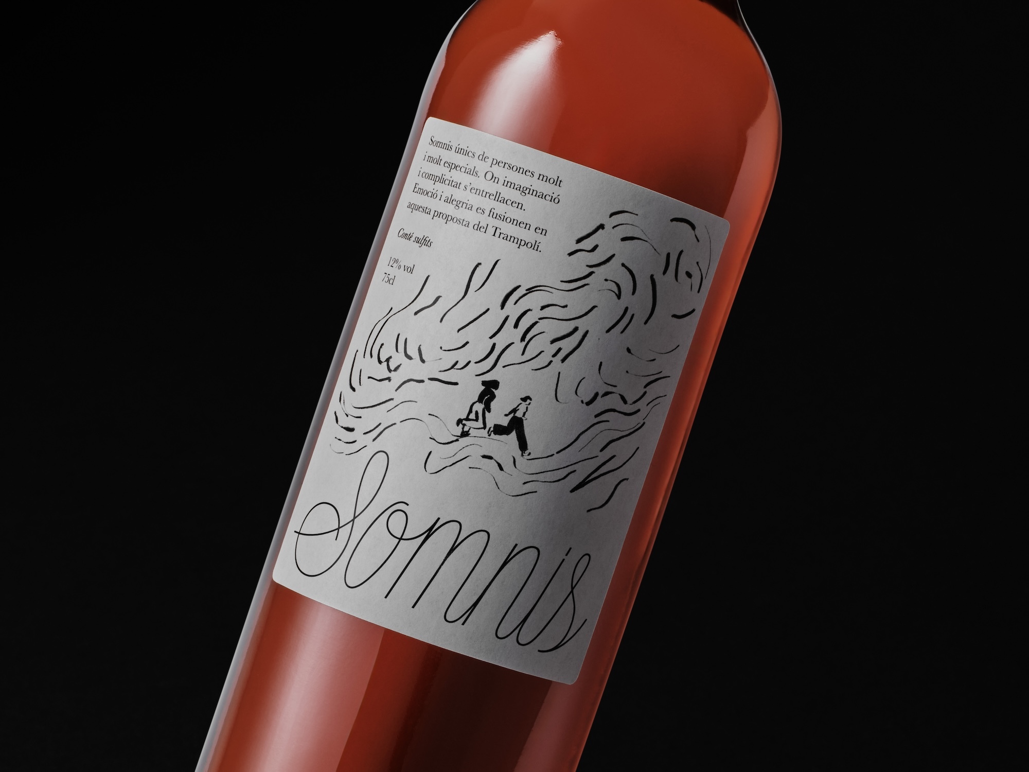 Close-up of a wine bottle featuring a white custom label with typographic text and line illustrations against a dark background