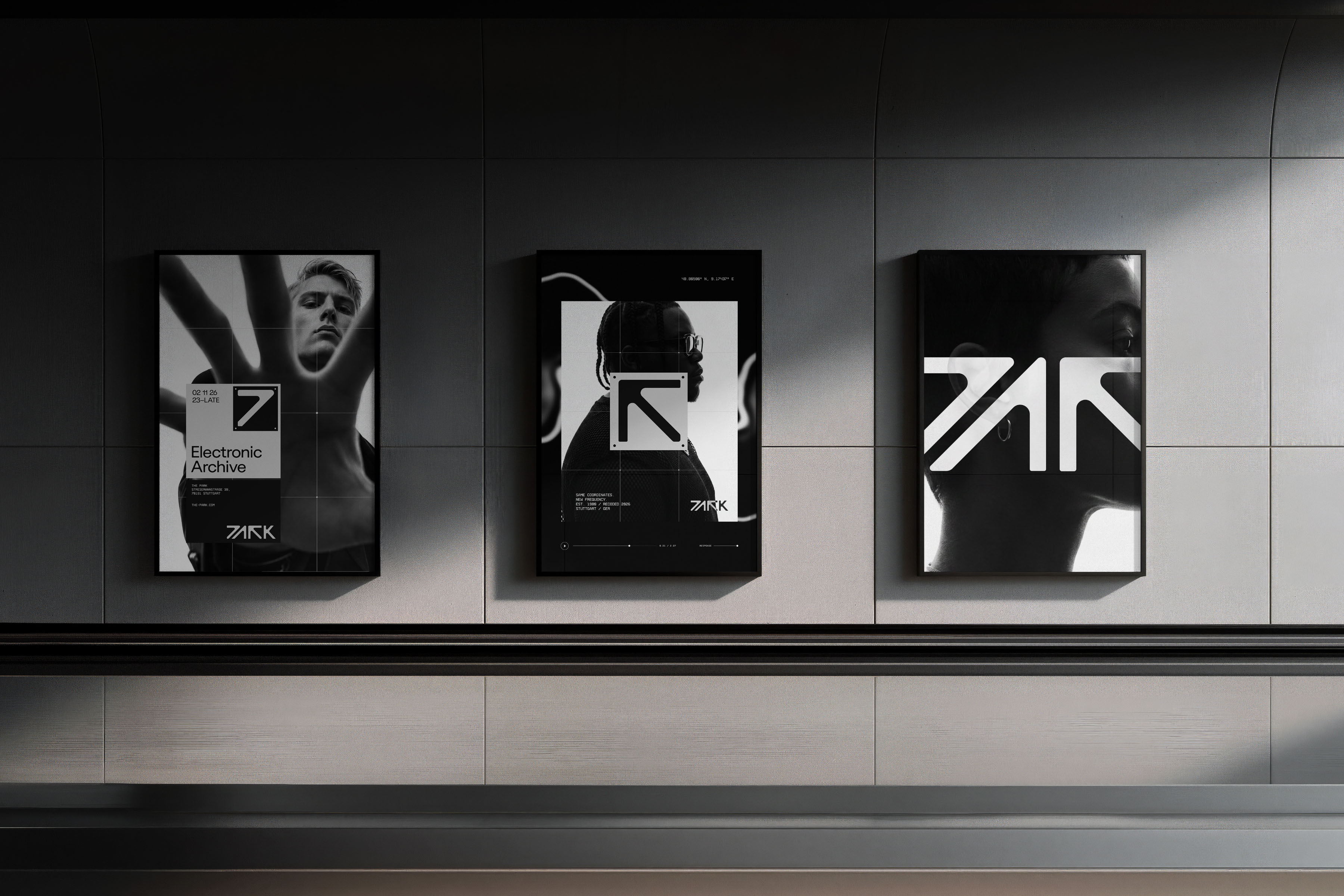 Three black and white posters showcasing graphic design and typography mounted on a tiled wall