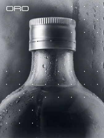 Close-up product shot of a glass bottle neck covered in condensation with a ridged metal cap, featuring ORO branding.