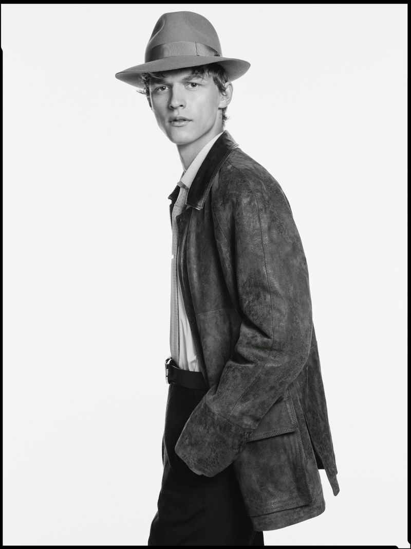 Man wearing a fedora hat and suede jacket against a plain white studio background for the Borsalino campaign
