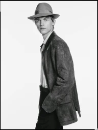 Man wearing a fedora hat and suede jacket against a plain white studio background for the Borsalino campaign