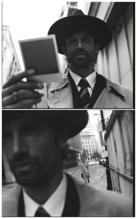 Man wearing a fedora hat and trench coat holding a polaroid photo outdoors in a split frame black and white editorial image.