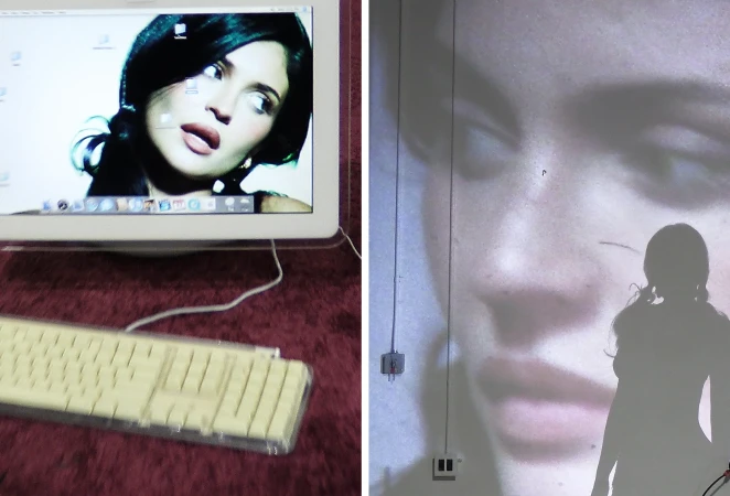 Kylie Jenner projected large on a wall next to a computer monitor displaying her portrait for Who What Wear