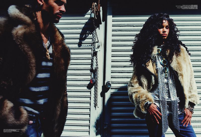 Model Daiane Sodre and male model standing outside against a ribbed metal shutter for V Magazine editorial
