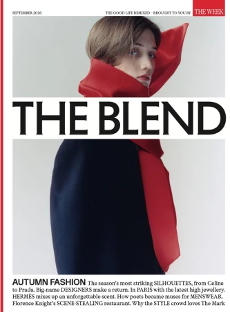 Model wearing a structured red collar and dark top against a pale background for The Blend magazine cover