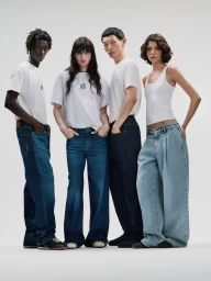 Four models standing side by side against a seamless white background wearing white shirts and denim jeans for Armani Exchange.