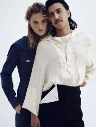 Portrait of two models posing together against a plain white studio background for The Sunday Times Style Magazine UK.