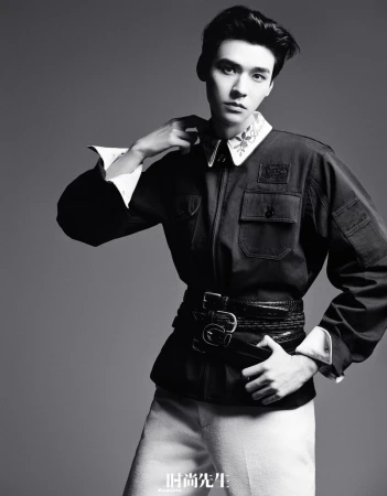 Monochrome portrait of Gong Jun wearing a dark utility jacket with multiple belts for Esquire China editorial