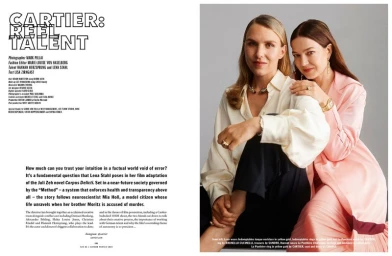 Two women posing together for an editorial portrait, wearing fine jewelry and styled clothing against a neutral studio backdrop.