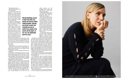 Blonde woman wearing a black cutout knit dress and Cartier gold earrings against a light grey background