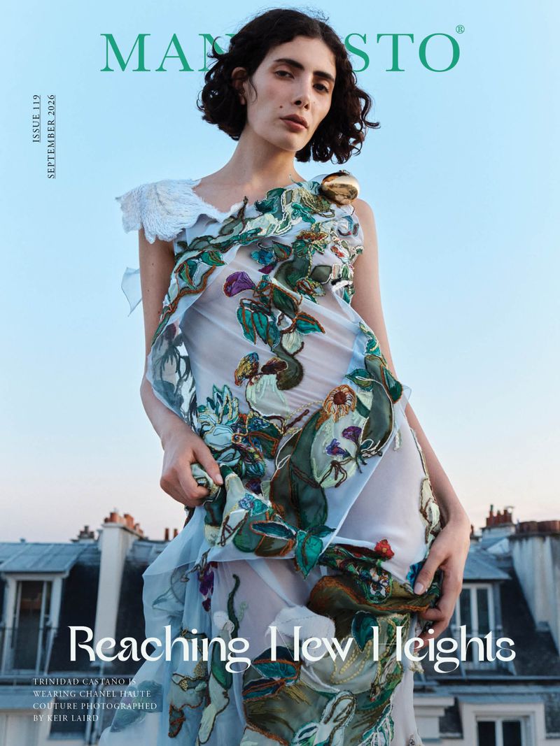 Model Trinidad Castano wearing embroidered couture dress against a rooftop background for Manifesto Magazine
