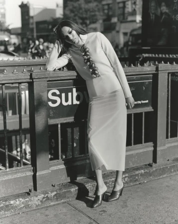 Model Ajah Angau Jok leaning against a subway entrance railing for 10 Magazine editorial project Harlem Renaissance
