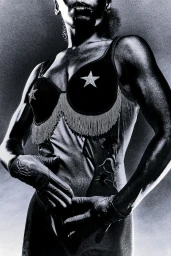 Black and white portrait of a muscular woman wearing a star-embellished bustier and gloves against a textured backdrop