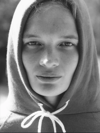 Close-up portrait of model Caitlin Soetendal wearing a hooded sweatshirt with white drawstrings for Pop Magazine.