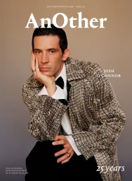 Josh O'Connor wearing a patterned tweed coat and bow tie, leaning forward against a gradient background for AnOther Magazine cover.