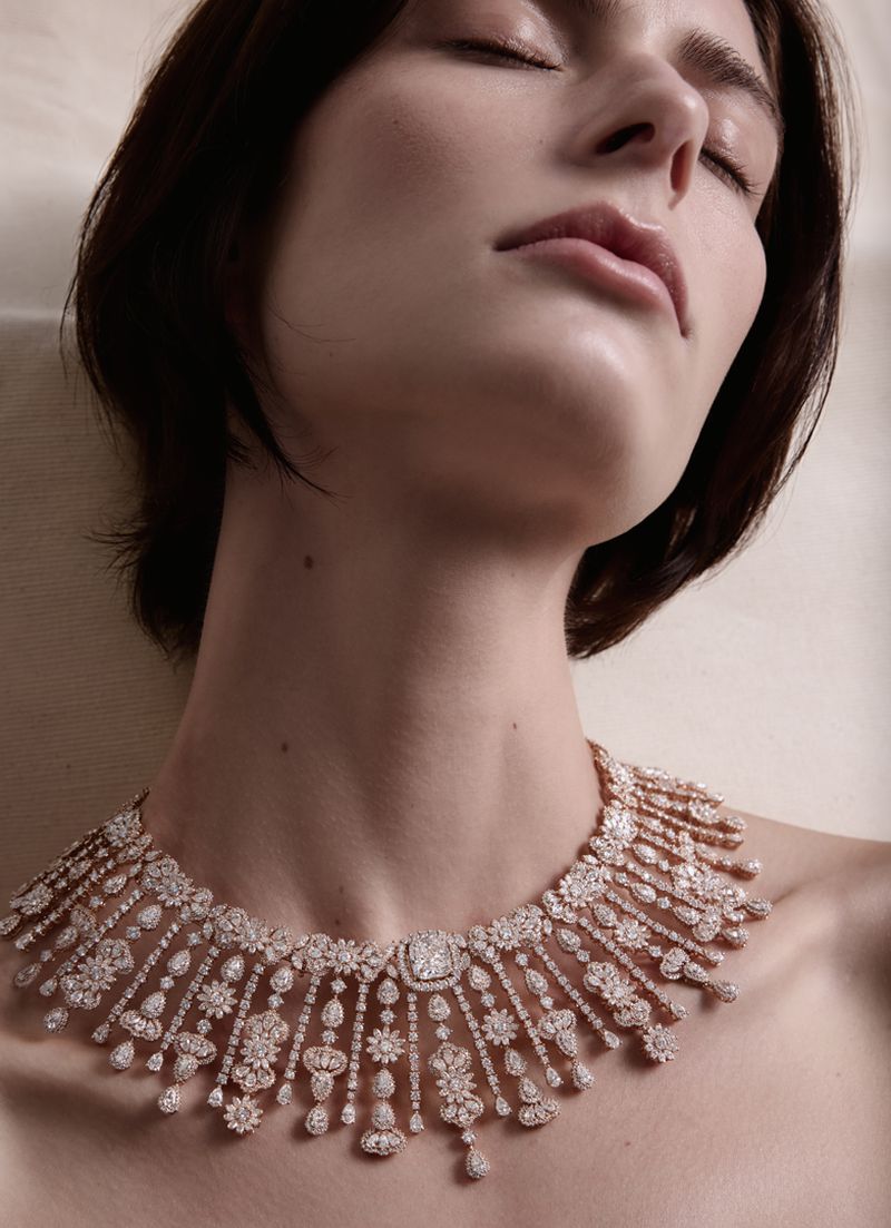 Close-up portrait of a woman wearing an intricate diamond statement necklace for Silhouette Magazine high jewellery project.