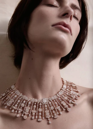 Close-up portrait of a woman wearing an intricate diamond statement necklace for Silhouette Magazine high jewellery project.